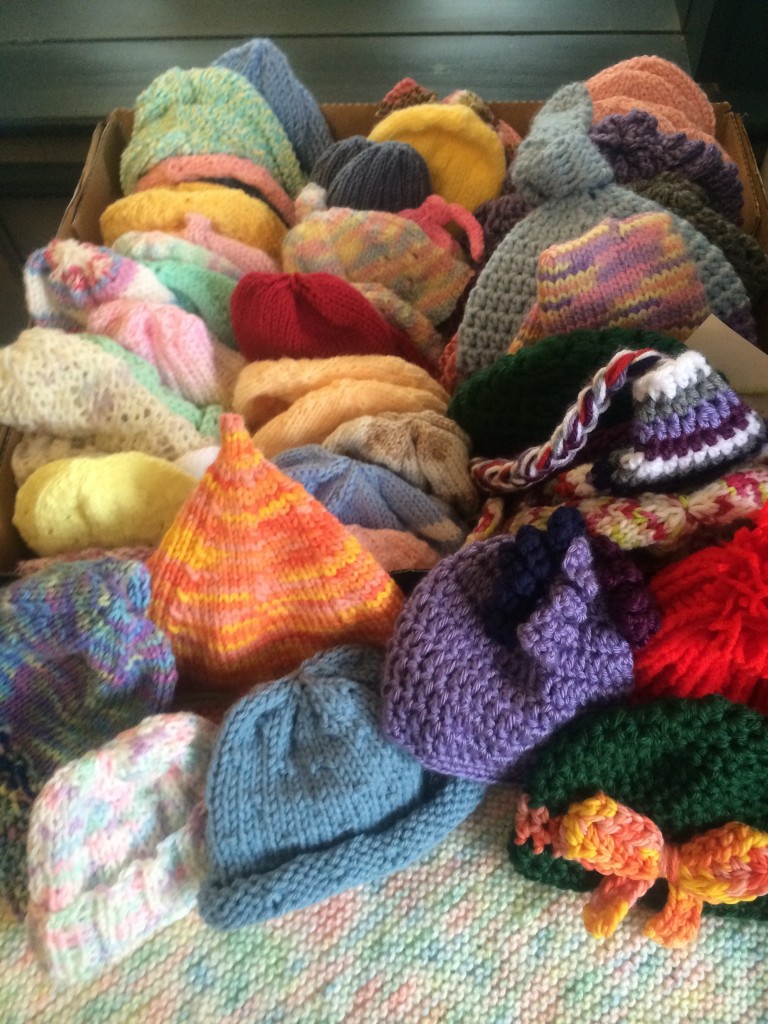 Newborn and preemie hats for babies at the Newton Wellesley Hospital. Knitted by the MIL Stitchers, the Morse Institute Library's community-oriented knitting and crocheting group.