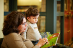 Mother and child reading a book